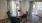 a dining room table with chairs