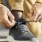 a pair of hands tying a shoe