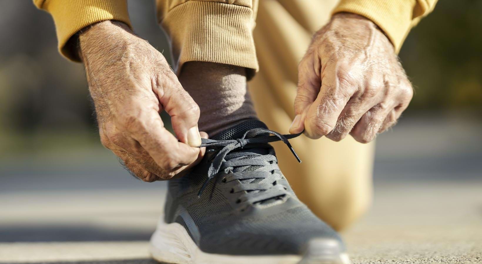 The essence of exceptional living a pair of hands tying a shoe
