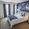 a bedroom with a bed and lamps