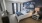 a bedroom with a bed and lamps