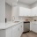 a kitchen with white cabinets