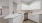a kitchen with white cabinets