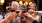 a group of people holding wine glasses
