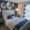 a bedroom with a bed and lamps