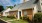 a brick house with a driveway
