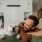 a man and his dog laying down on a bed