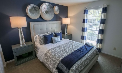 beautiful bedroom with blue wall