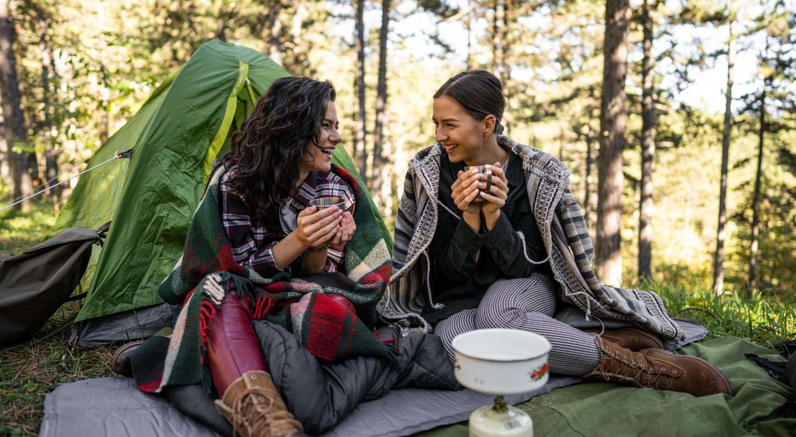 Find your perfect fit at Kensington Grove a group of women sitting on a blanket in the woods
