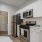 a kitchen with white cabinets
